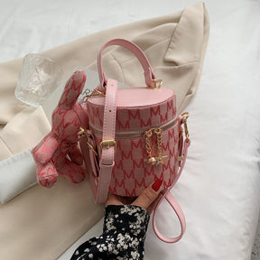 CYLINDER CROSSBODY BAG